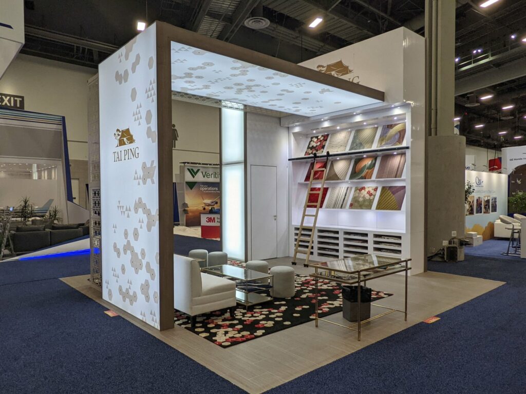 Example of how to display products at a trade show featuring a small, well-organized booth with an array of items attractively showcased on shelves and stands.